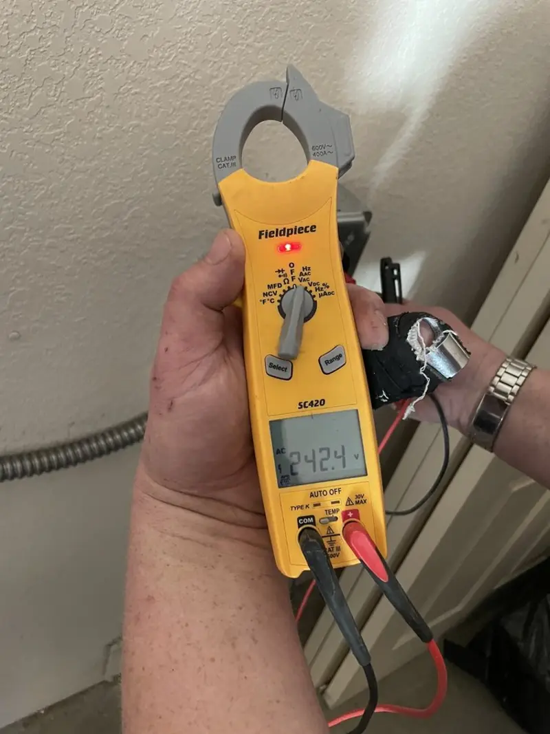 Voltage testing with clamp meter during Outlet Installation in Herkimer